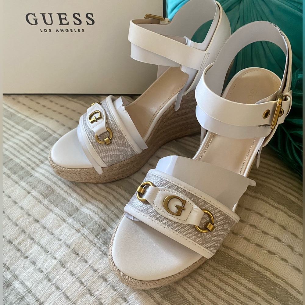 Guess wedge sandals, never worn. Like new. Super cute summer shoes.
